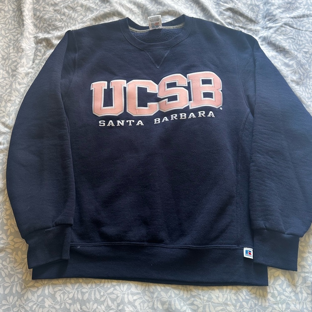 Navy blue UC Santa Barbara crew neck sweater with UCSB logo in pink